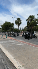Motorcycle group ride parade through urban area