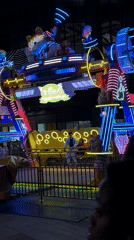 Father and child enjoy indoor amusement ride in Jiangning District