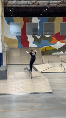 Rollerbladers practice tricks at indoor Krasnoyarsk skatepark during morning session