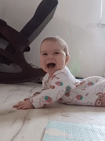 Baby laughs, candy unwrapped in Russian village moments