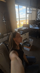 Woman takes multiple selfies during photo session in Chaikovsky