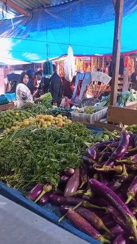 Early morning market bustle and street food prep in Lhokseumawe