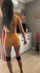 Woman takes selfies in yellow outfit in Montenegro resort