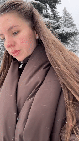 Woman filmed during snowfall in Klin, Russia