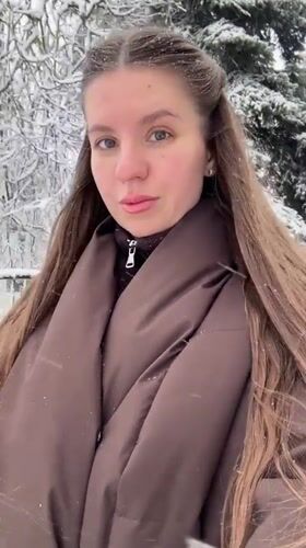 Woman filmed during snowfall in Klin, Russia