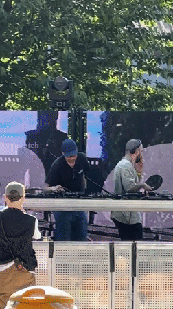 DJs perform at casual outdoor gathering in Milan park