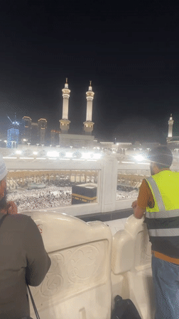 Evening at the Grand Mosque, Mecca — crowds, the Kaaba, clock tower