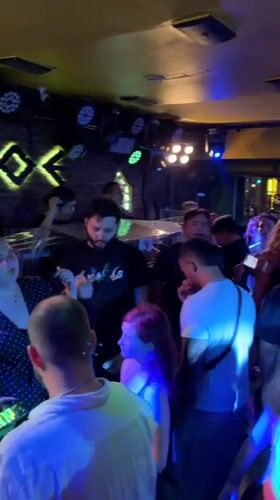 Chiang Mai nightlife district bustling with crowds, dancing, entertainment