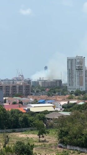 Fire smoke visible across Pattaya cityscape during morning hours