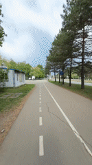 Woman cycles tree-lined bike path in Birobidzhan, Russia