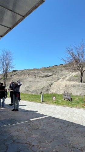 People gather at outdoor meeting spot in Kvakhvreli, Georgia
