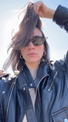 Woman films selfie video in sunny Belgrade suburb