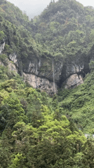 Tourist captures scenic Zhangjiajie landscapes during morning mountain visit