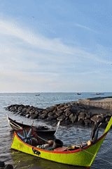 Fishing boats and angler spotted at Lhokseumawe seafront