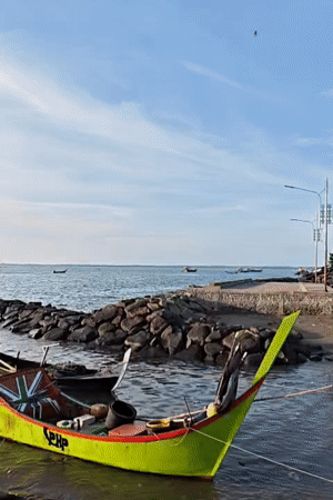 Fishing boats and angler spotted at Lhokseumawe seafront