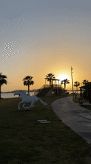 Mother and baby enjoy sunset at Fethiye park