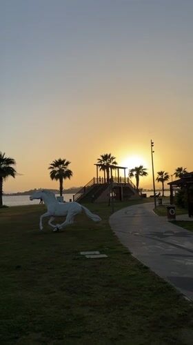 Mother and baby enjoy sunset at Fethiye park