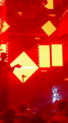 DJ performs at Buenos Aires nightclub under neon lighting