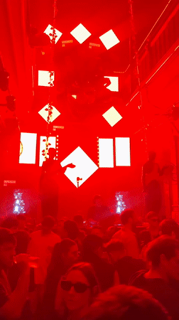 DJ performs at Buenos Aires nightclub under neon lighting