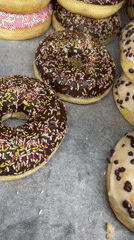 Colorful donuts with various toppings displayed in Dronten