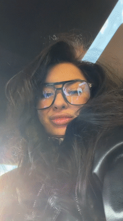 Woman records selfie video in Moscow wearing leather jacket