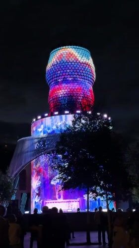 Colorful tower projections and a nighttime Moscow drive.