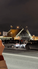 Saint Petersburg crowds watch Palace Bridge opening at night