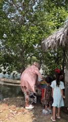 Outdoor communal meal by the water in Dayahtuha, Indonesia