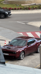Dodge Challenger parked with traffic cone in Montenegro village