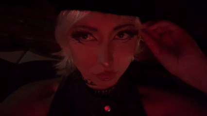 Red-lit close-up portrait shot in Milan