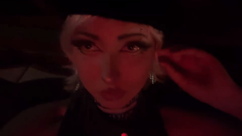 Red-lit close-up portrait shot in Milan