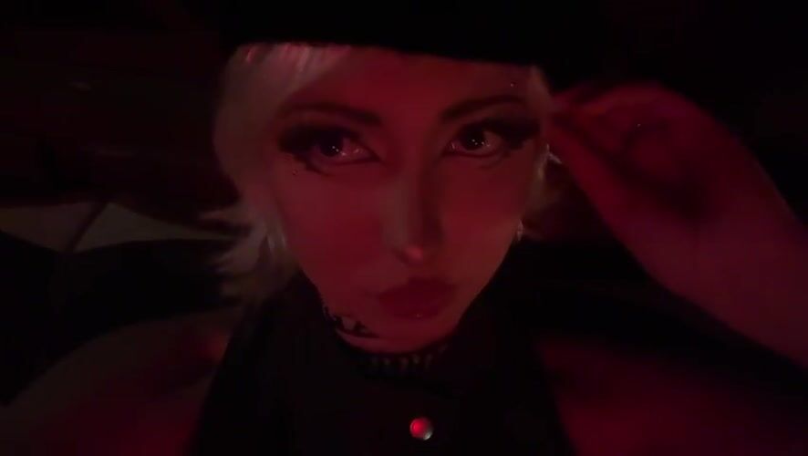 Red-lit close-up portrait shot in Milan
