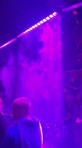 Nightclub scene captured in red lighting in Coachella