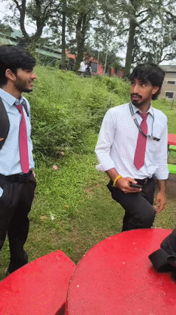 Uniformed group outing at a green outdoor site in Dharamshala