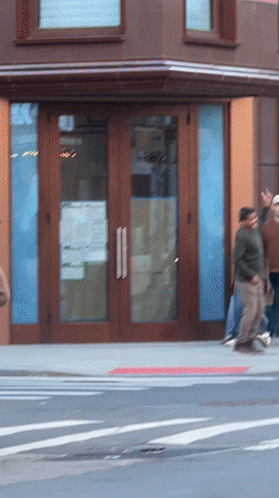 Man dances enthusiastically on New York street corner