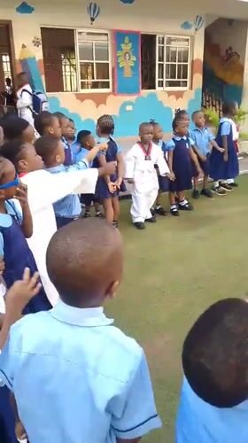 Children arrive at school in Idimu, Nigeria