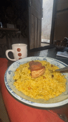 Man enjoys fried rice meal in Badagry, Nigeria