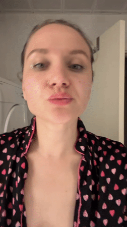 Woman performs evening skincare routine in Esenyurt bathroom