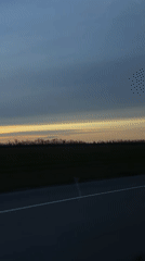 Scenic sunrise/sunset captured from moving vehicle near Сонино, Russia