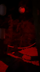 Nighttime bar or lounge area glowing in red and blue light.