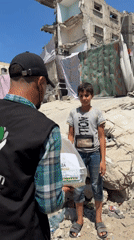One Nation hands out food to children in war-damaged Gaza