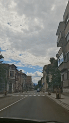 Urban drive through city streets and landmarks