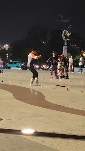 Skaters and locals fill a Da Lat plaza on a summer night