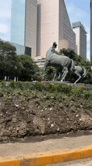 Bronze charro sculpture and street view documented in Mexico City