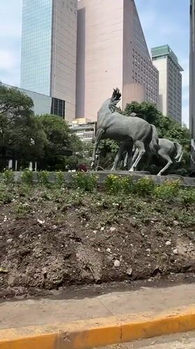 Bronze charro sculpture and street view documented in Mexico City