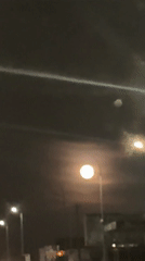 Full moon observed from moving vehicle in Rainham
