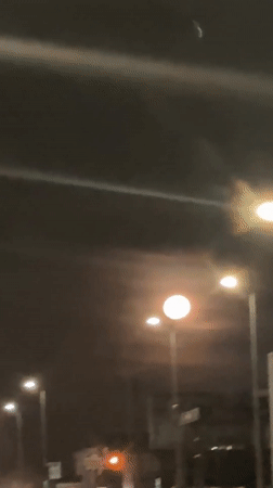 Full moon observed from moving vehicle in Rainham