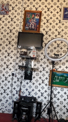Person films self-videos in decorated bedroom in Jos