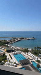 Seagulls visit resort balcony overlooking Alanya waterpark