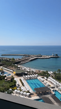 Seagulls visit resort balcony overlooking Alanya waterpark